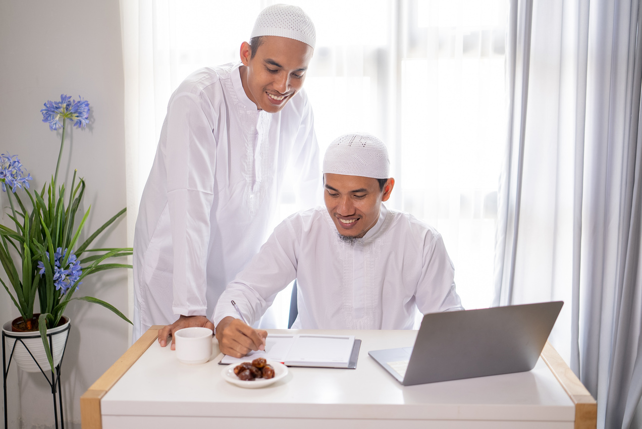 Muslim Business Partner Discussing and Meeting Using Laptop